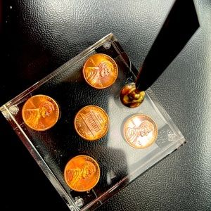 Pen holder with (5) 1974 No Mint Pennies
